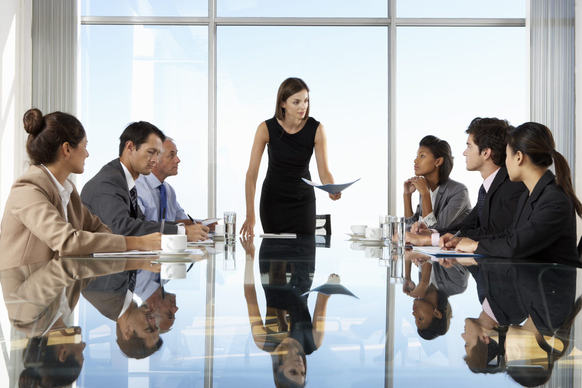 Group,Of,Business,People,Having,Board,Meeting,Around,Glass,Table